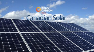 Canadian solar panels harnessing sunlight on rooftops and fields with the Canadian Rockies in the background, symbolizing sustainability and renewable energy.